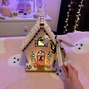 Ghoulish pink Halloween haunted house gingerbread viral TikTok